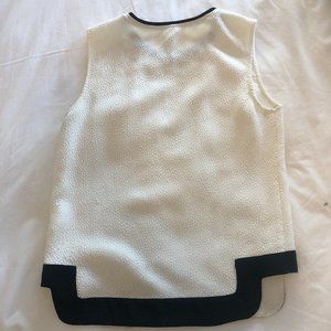 White with black trim sleeveless blouse